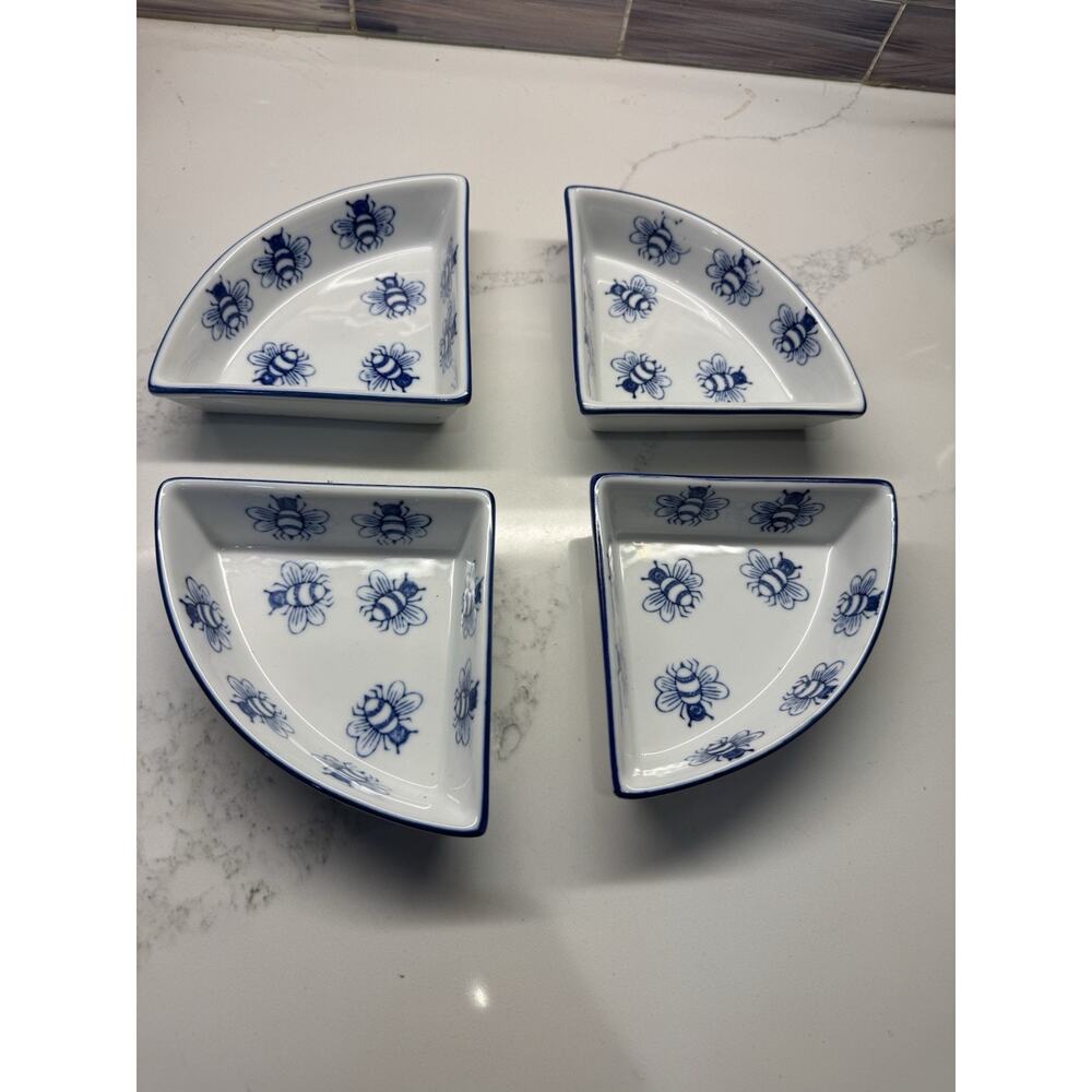 A set of four porcelain serving trays